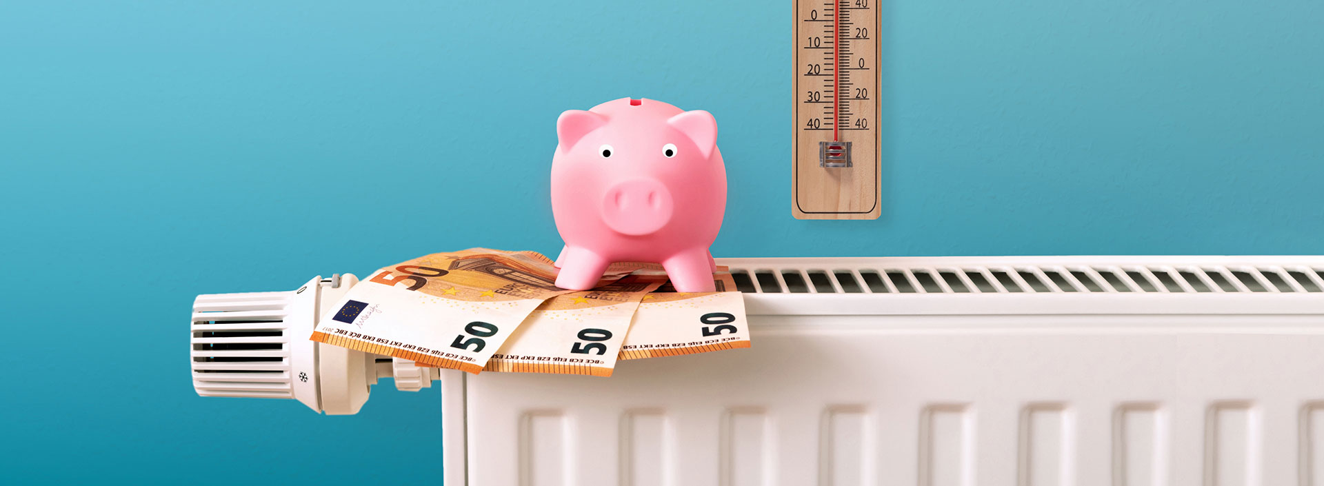 Heizung mit Geld, Sparschwein und Thermometer