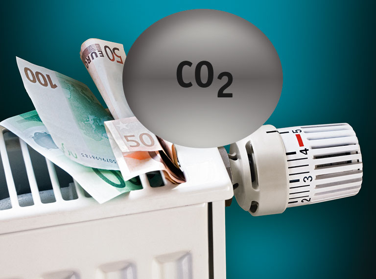 Heizk&ouml;rper mit Geldscheinen und Hinweis auf CO2 Steuer